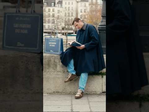 Raphaël Quenard with his “Les Fleurs du mal” by Charles Baudelaire Dior Book Cover Tote