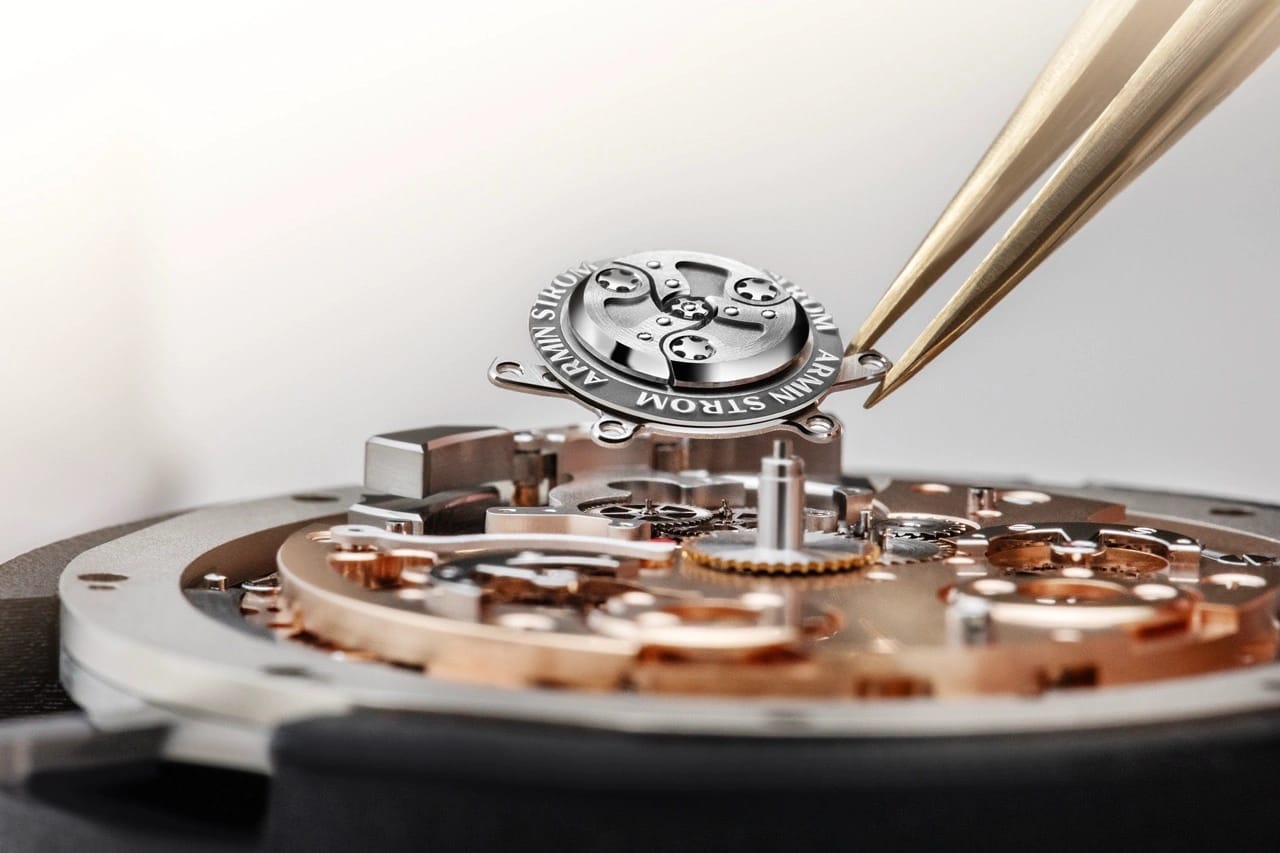 Dial-side view of the Armin Strom Minute Repeater Resonance 12:59 First Edition highlighting the twin balance wheels and resonance clutch