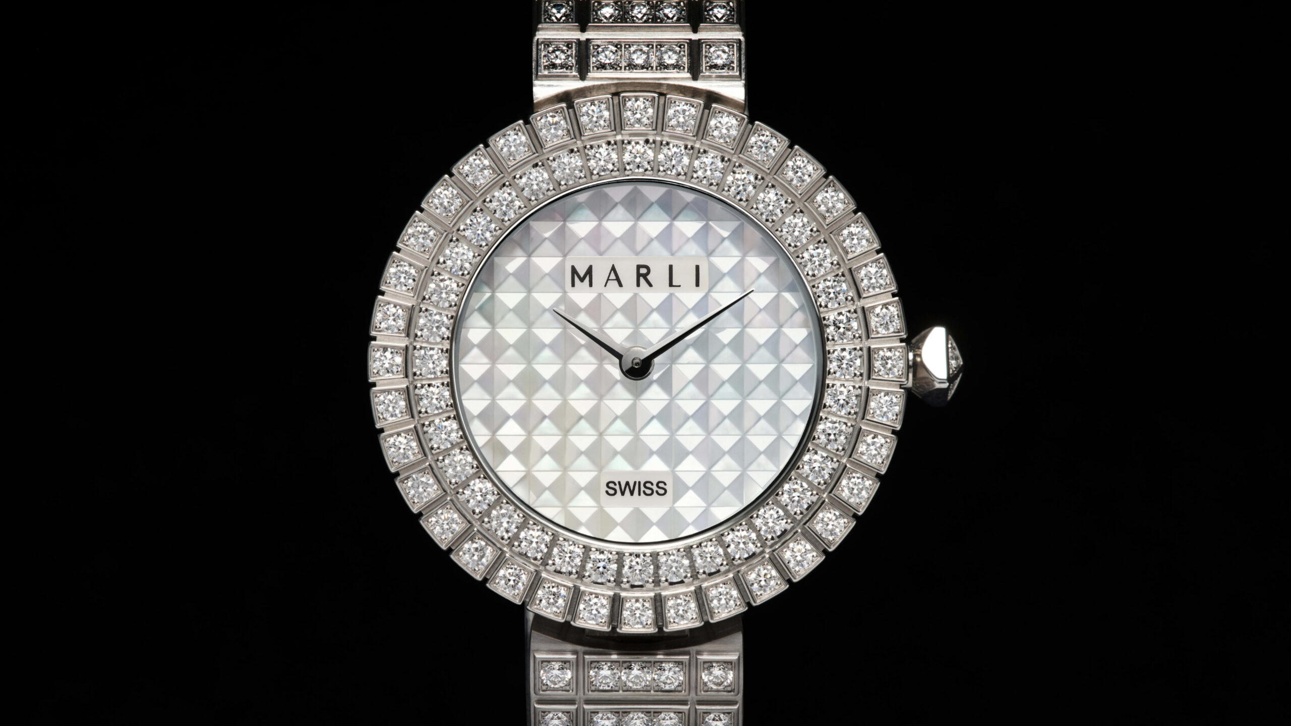 Detail of the MARLI Timepiece L35 case and crown showing the architectural bezel and diamond-set pyramid crown