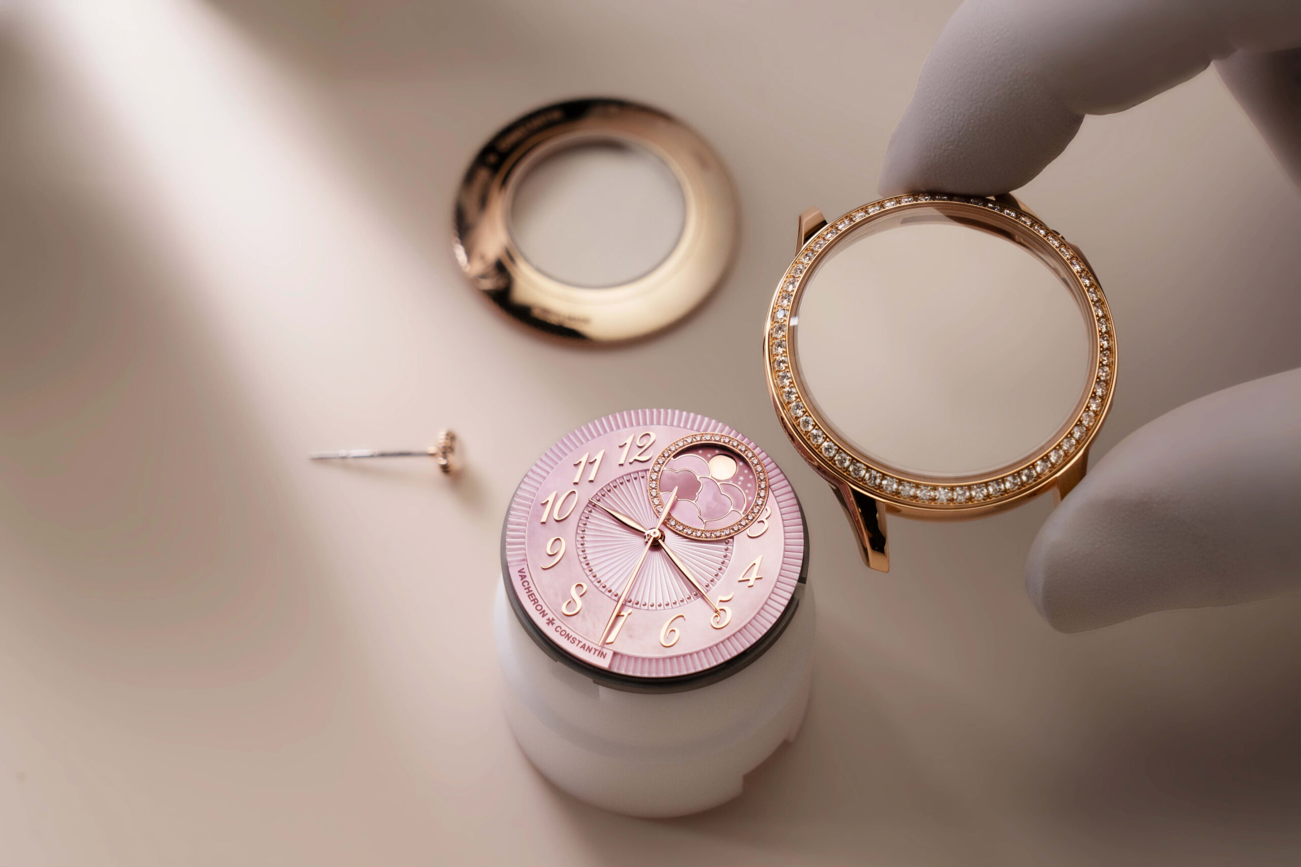 Detail of the pink mother-of-pearl dial and moon phase of the Égérie Moon Phase Spring Blossom