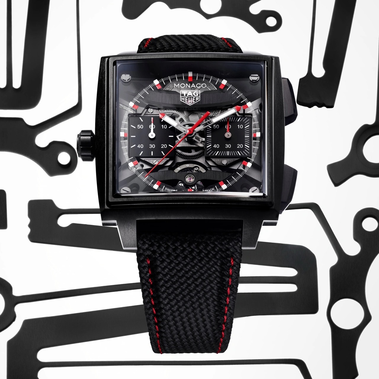 Two executions of the TAG Heuer Monaco Evergraph in Grade 5 titanium, including blue and black DLC-coated versions