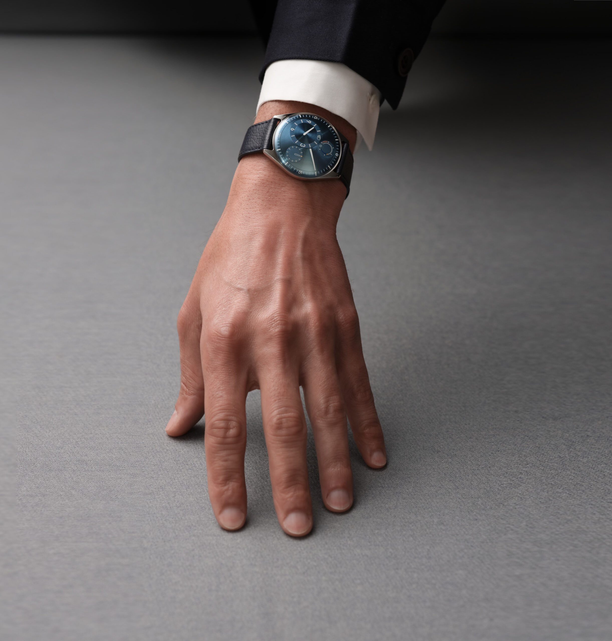 Ressence TYPE 11 on bracelet, illustrating the slim titanium profile and contemporary wrist presence