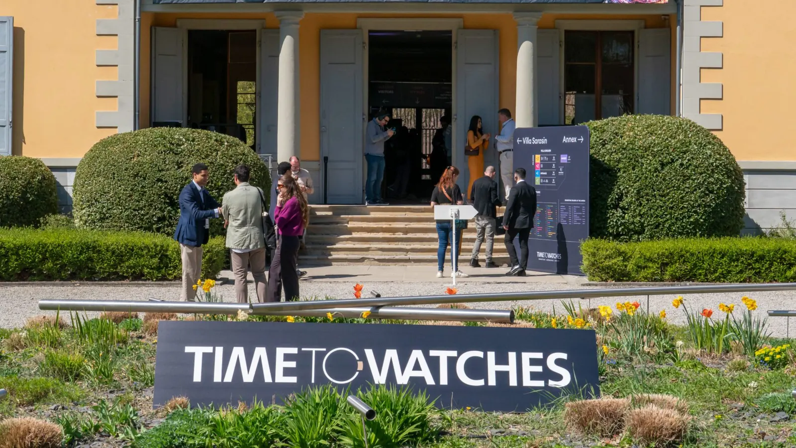 Time to Watches 2026 Geneva watchmaking festival — crowd energy and brand booths at the Village