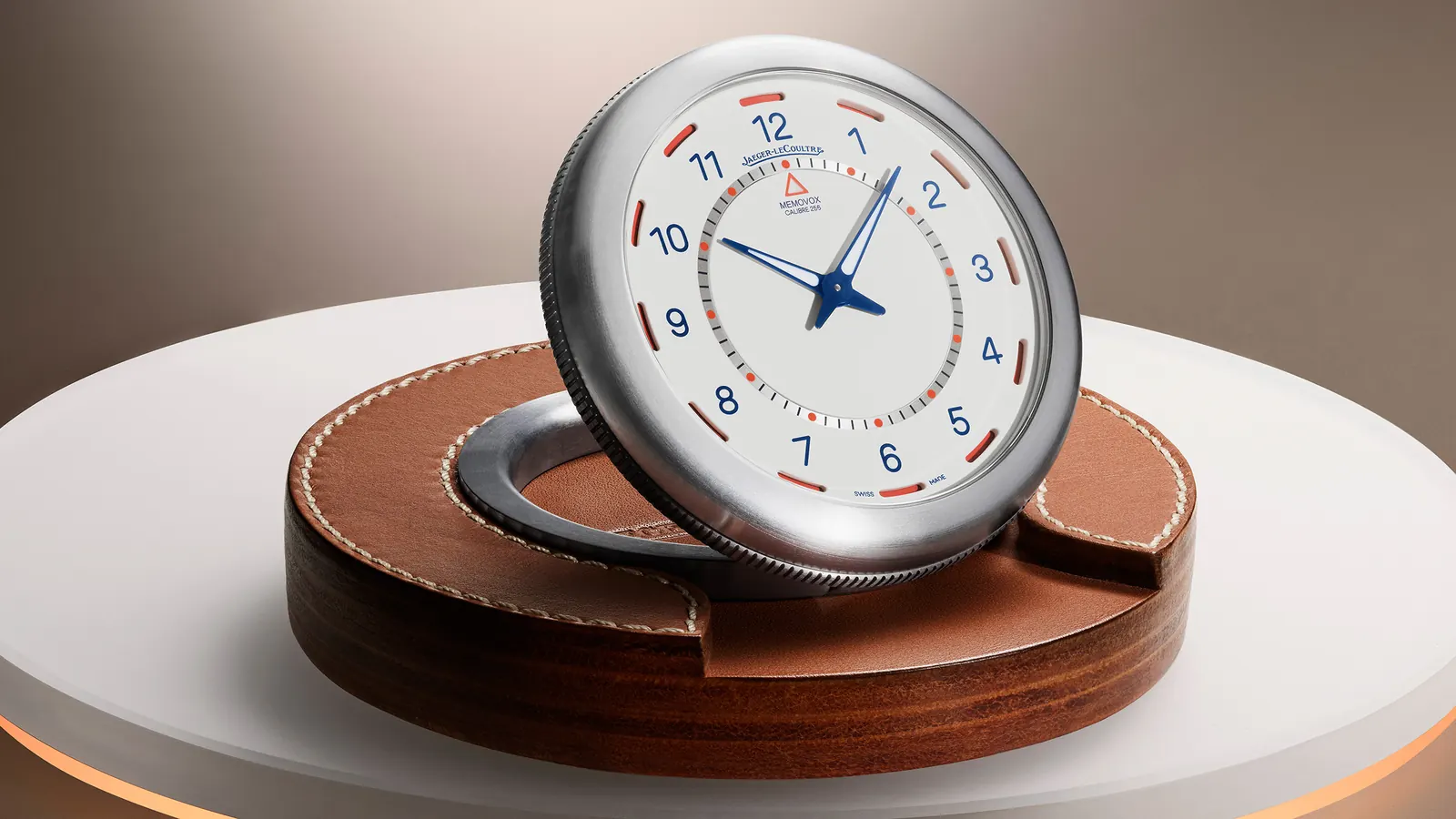 Jaeger-LeCoultre Memovox Travel Clock by Marc Newson — titanium sphere with opaline dial and orange-blue power reserve display