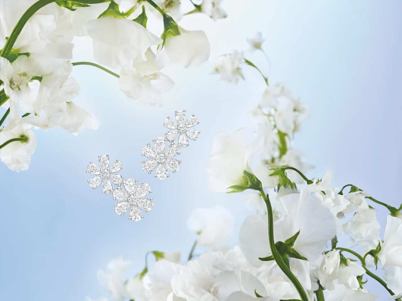Harry Winston Forget Me Not Collection — twin blossom pendants in pink sapphire and diamond