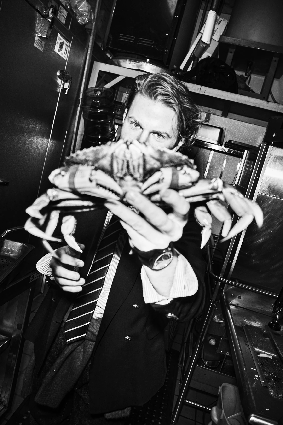 Flynn McGarry in a kitchen setting wearing an Urban Jürgensen watch
