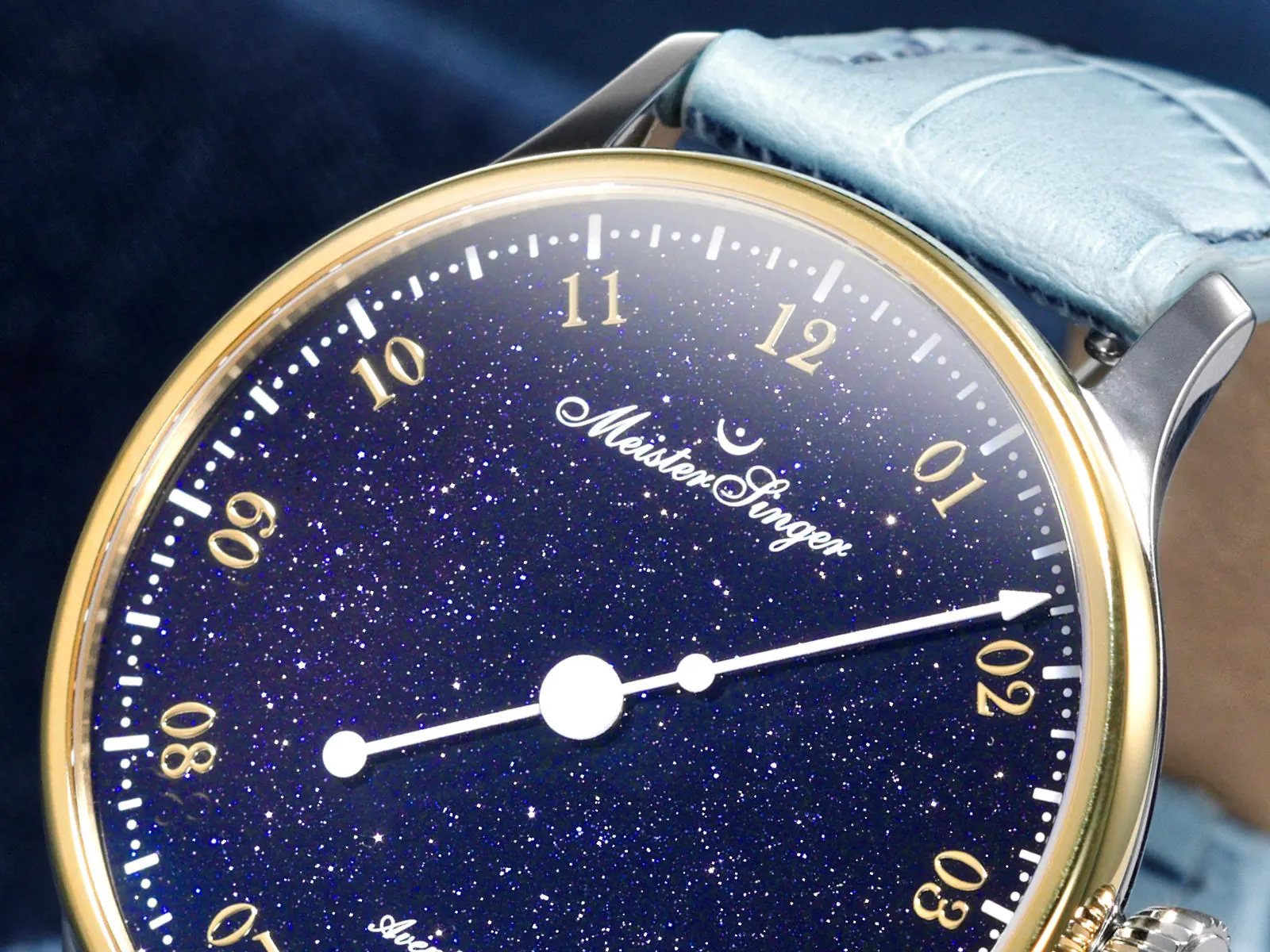 MeisterSinger Pangaea Aventurine dial detail showing gold numerals and star-like minute dots