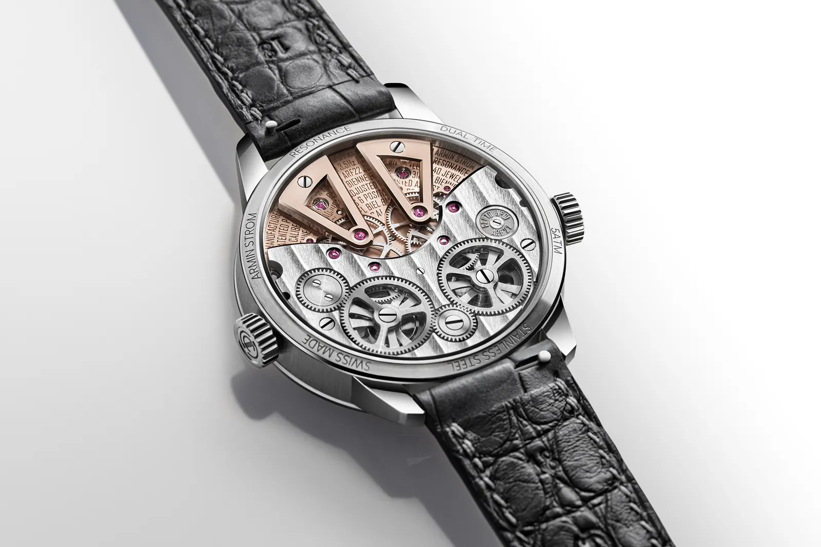 ARF22 movement reverse side with Côtes de Genève finishing and rose gold coloured gear-train bridges