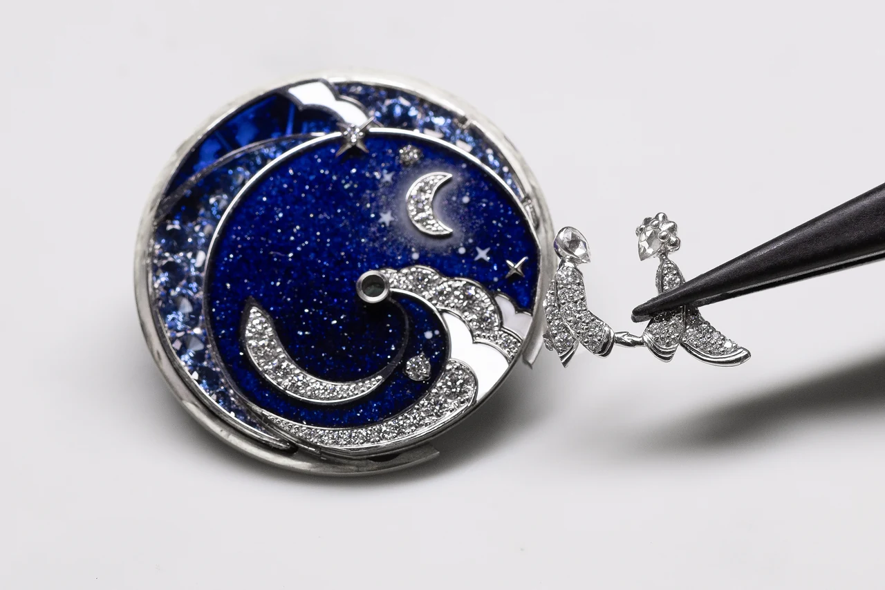 Detail of the Lady Rencontre Céleste dial showing plique-à-jour enamel clouds and rose-cut diamond figures
