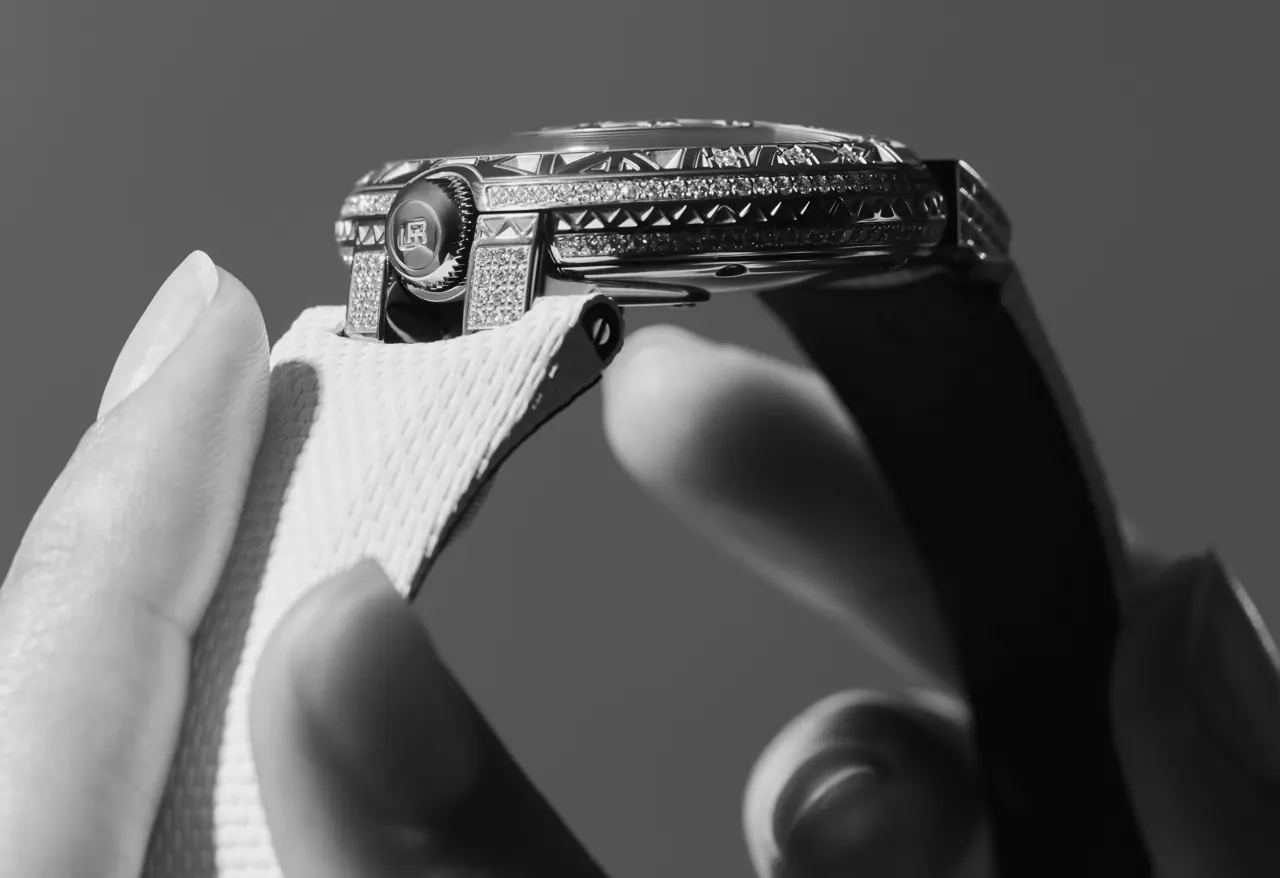 URWERK UR-101 Diamond Sky case side profile with mechanically engraved geometric constellation motif
