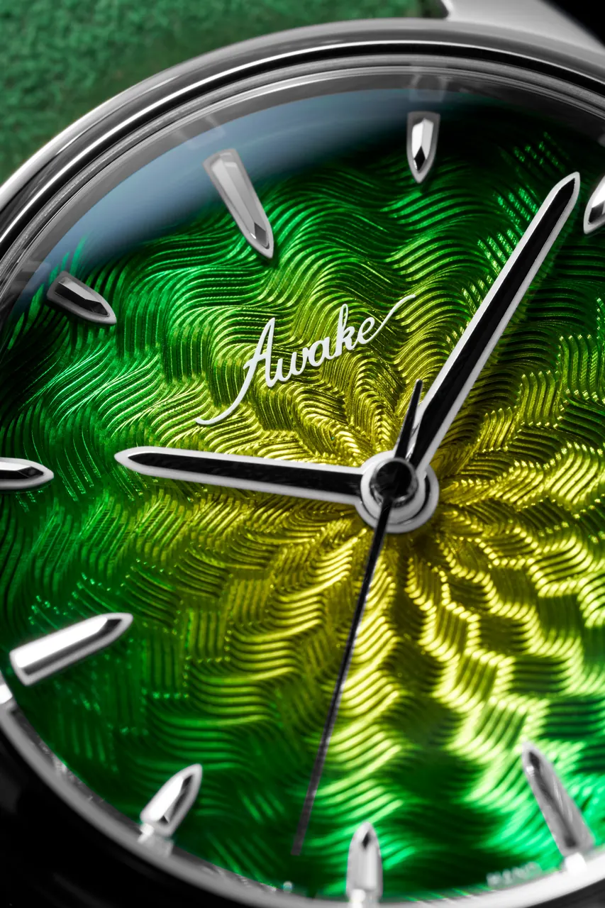 AWAKE Borealis dial — radiant guilloché pattern with aurora borealis lacquer effect