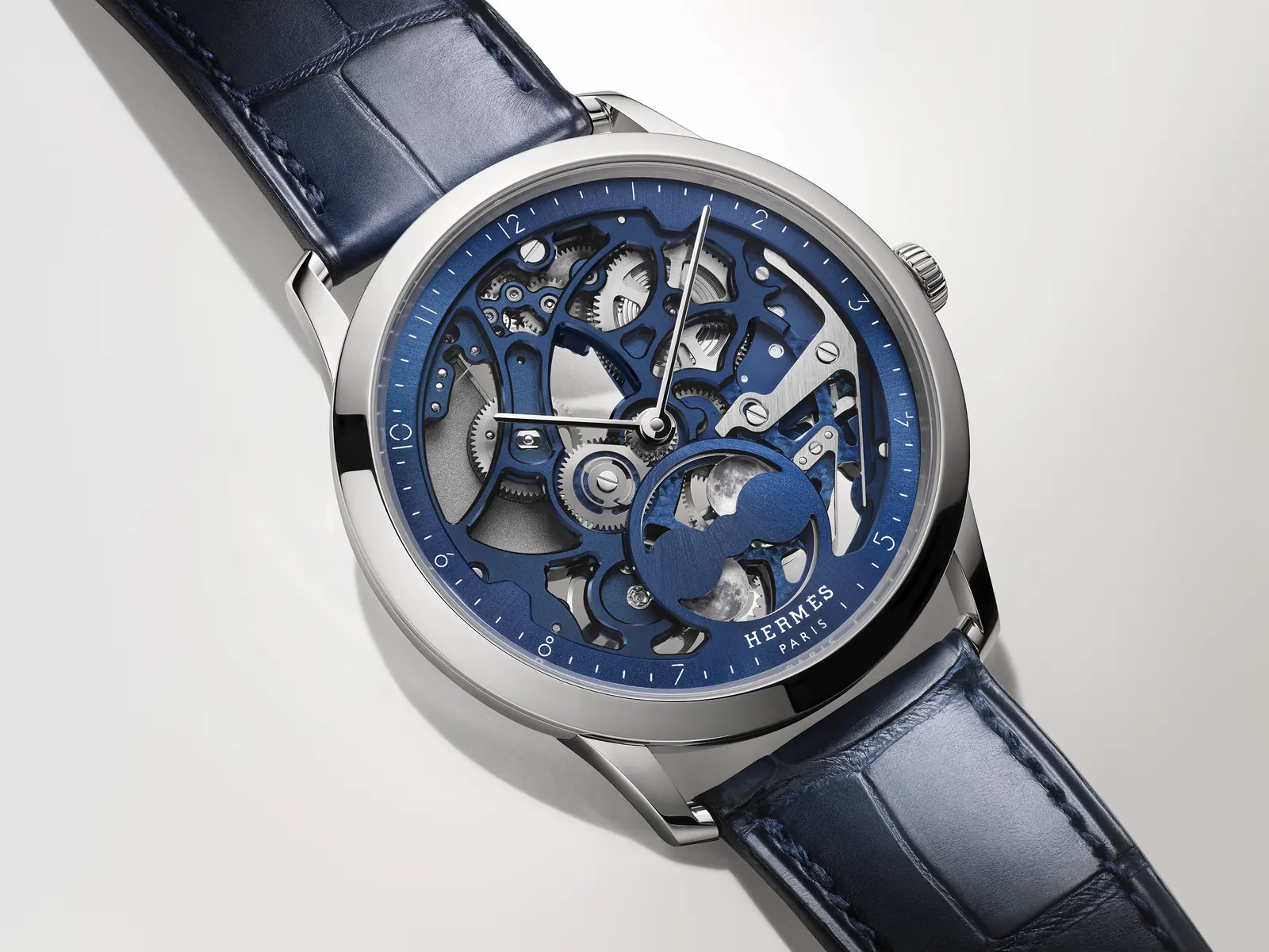 Hermès H08 Squelette in satin-brushed titanium with openworked black dial and blue Super-LumiNova markers