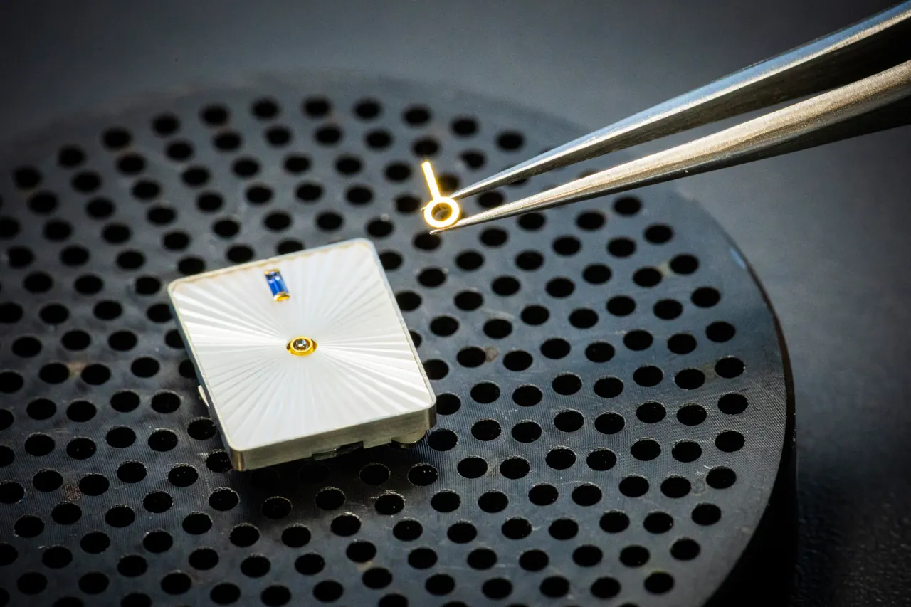Van Cleef & Arpels Ludo Secret Watch opening mechanism revealing the white guilloché mother-of-pearl dial