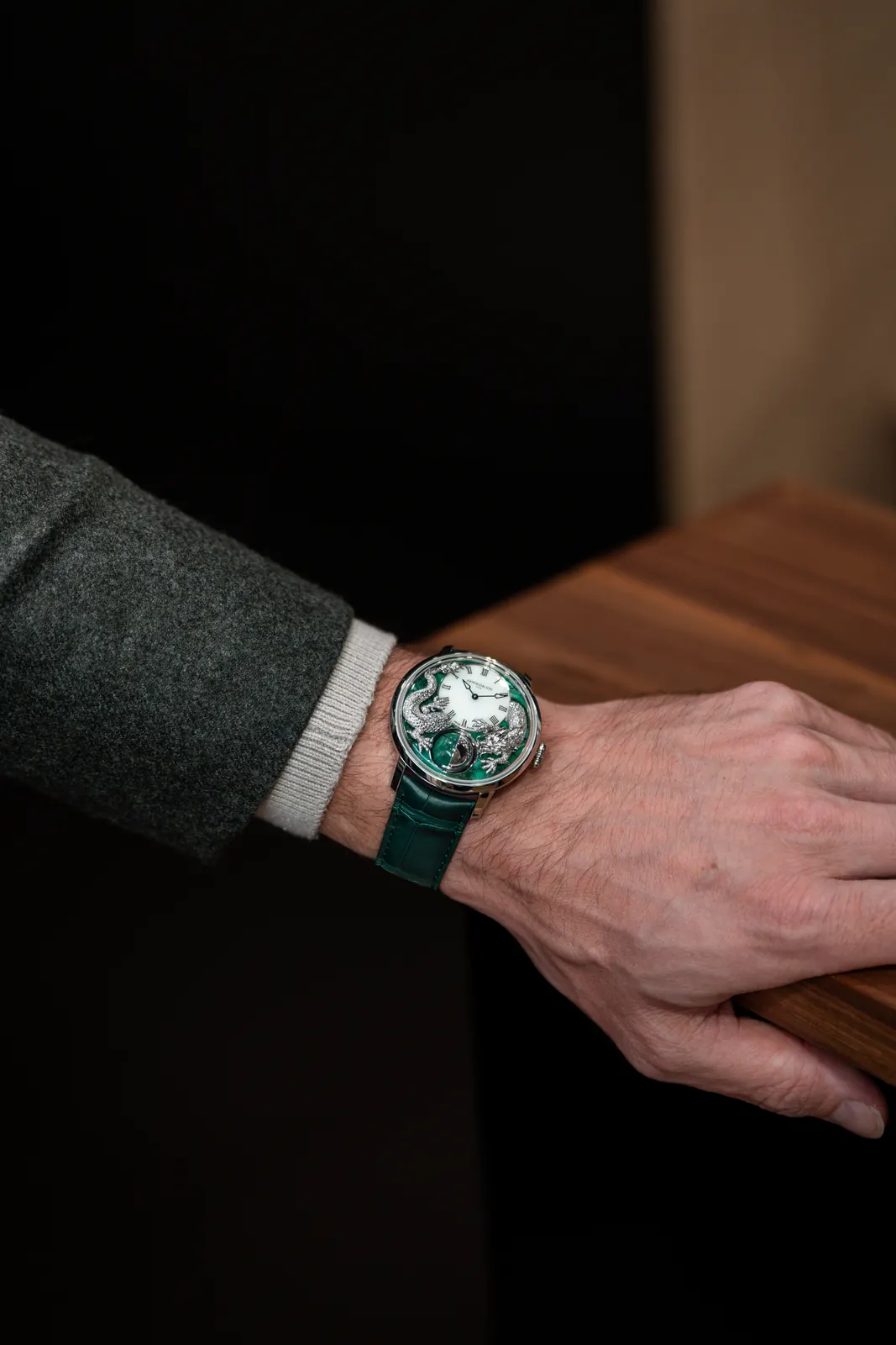 Detail of hand-engraved dragon scales and talons on Arnold & Son Luna Magna Platinum