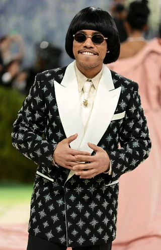 Rami Malek wearing Cartier Collection Crash watch 1992 and star brooch at the 2026 Met Gala