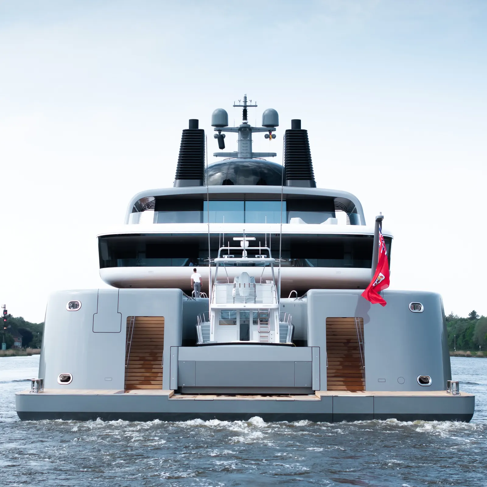Nausicaä superyacht exterior profile showing continuous glass band and cylindrical steel forms designed by Marc Newson