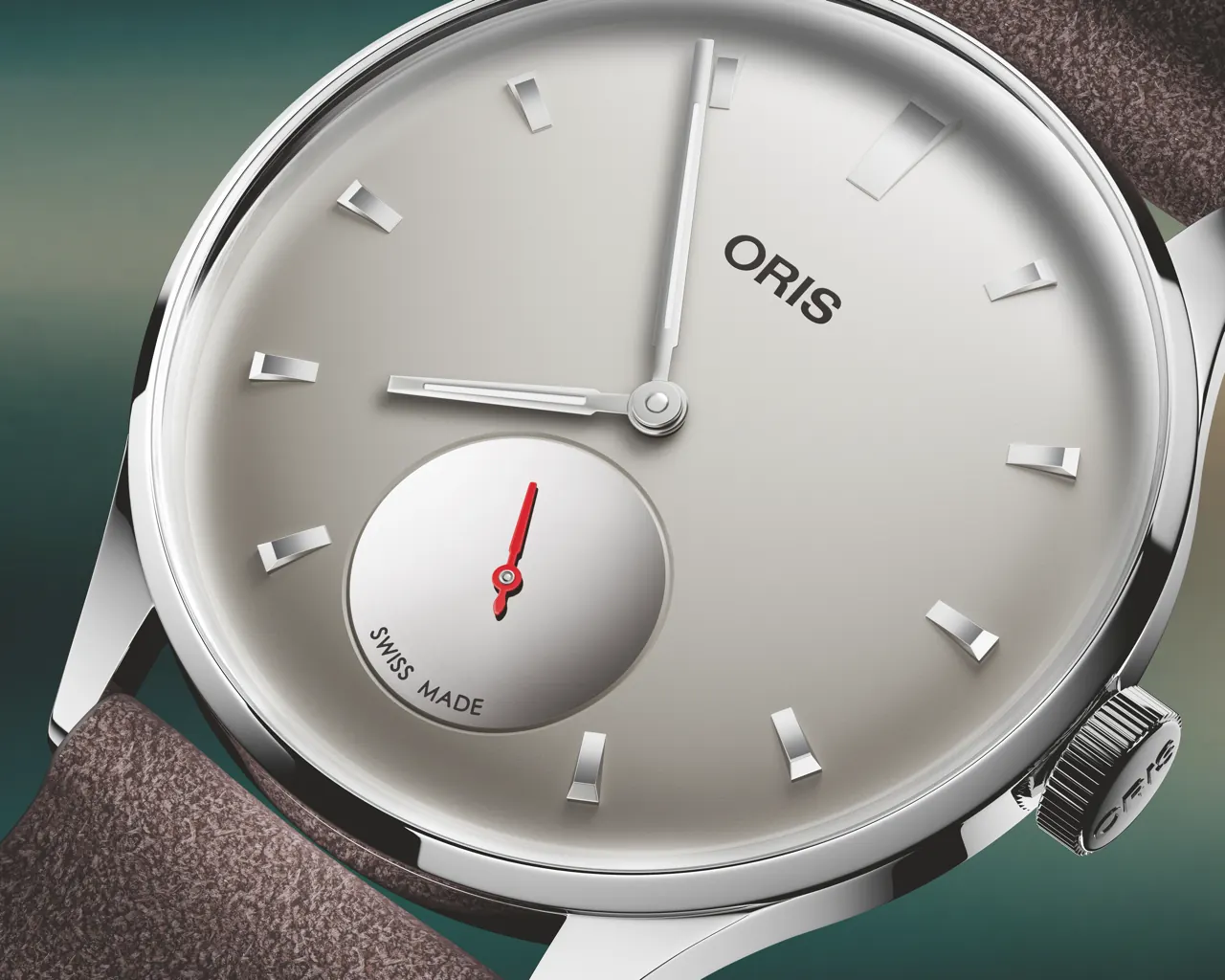 Oris Hölstein Edition 2026 dial showing light grey face with mirrored small seconds counter and red seconds hand