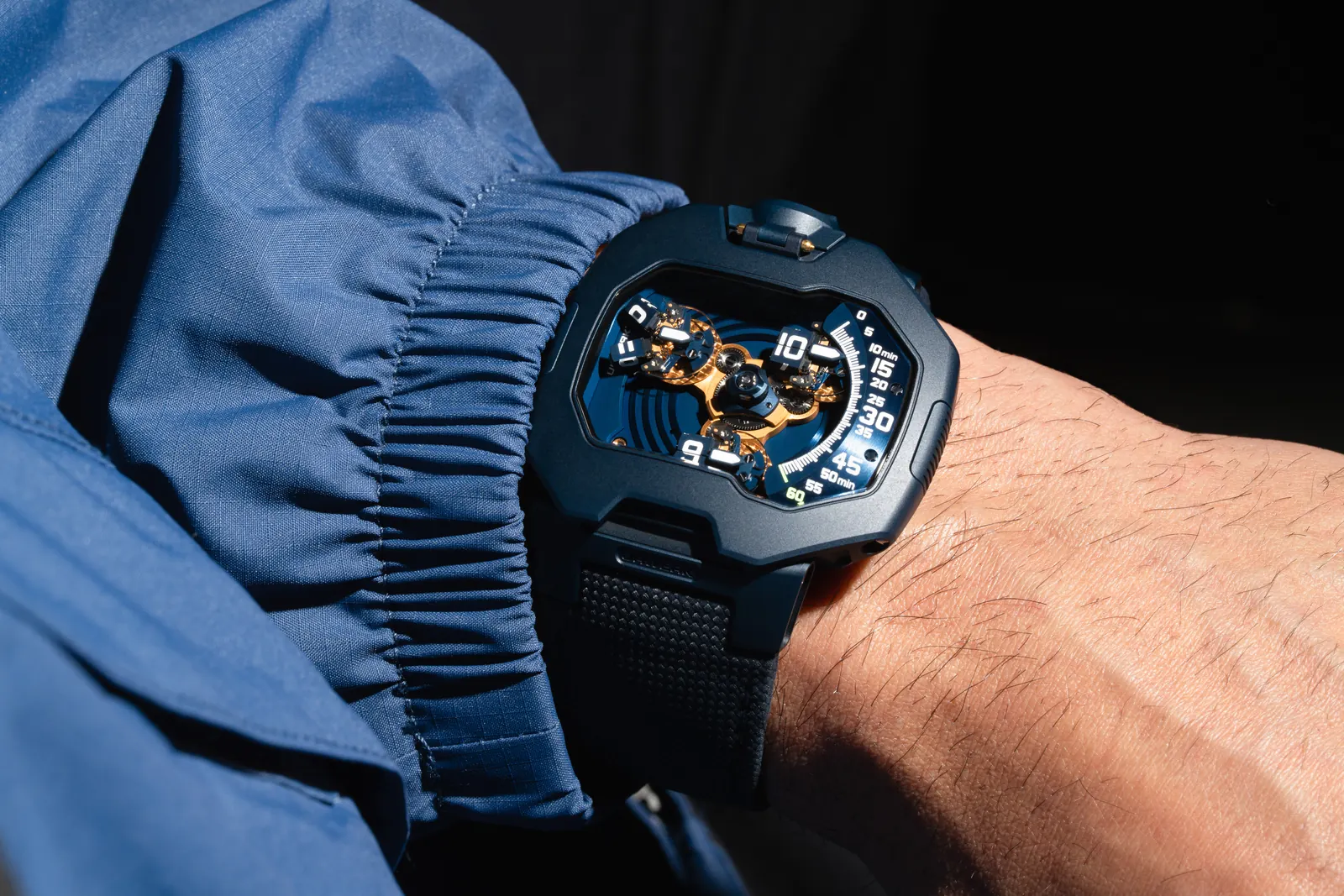 URWERK UR-120 Blue Planet full case view in deep blue with gold PVD accents