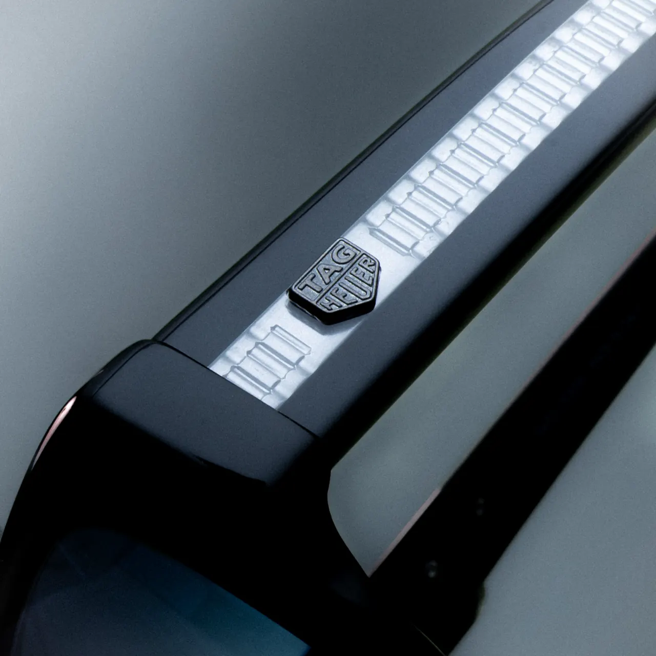 TAG Heuer Golden Age sunglasses in shiny black acetate with crystal temples revealing H-Links inspired structure