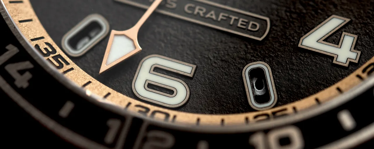 Mauron Musy MU04 GMT Sport titanium-ceramic bezel dial view showing cast-iron texture and champlevé hour-markers