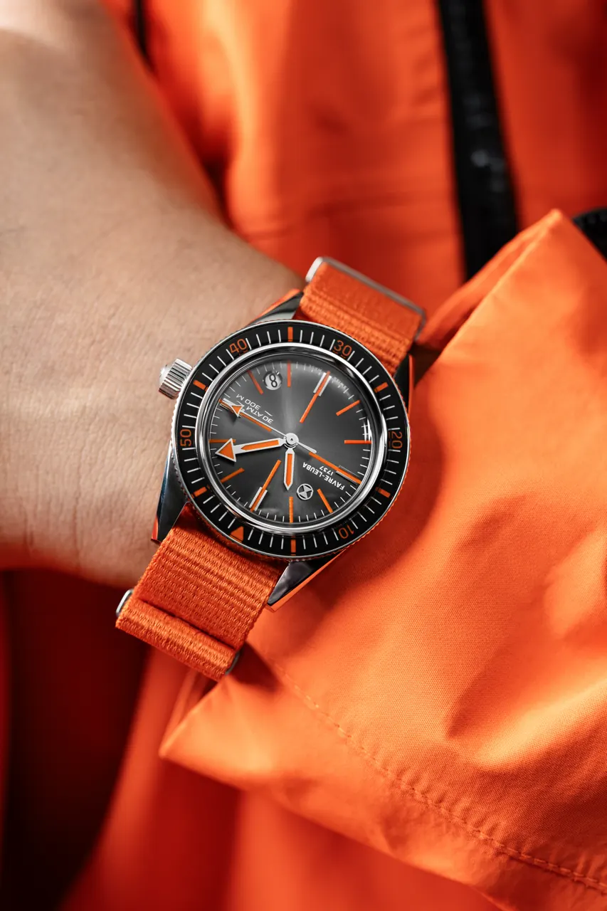 Favre Leuba Deep Raider Revival Orange dial close-up showing sunray finish and orange accents