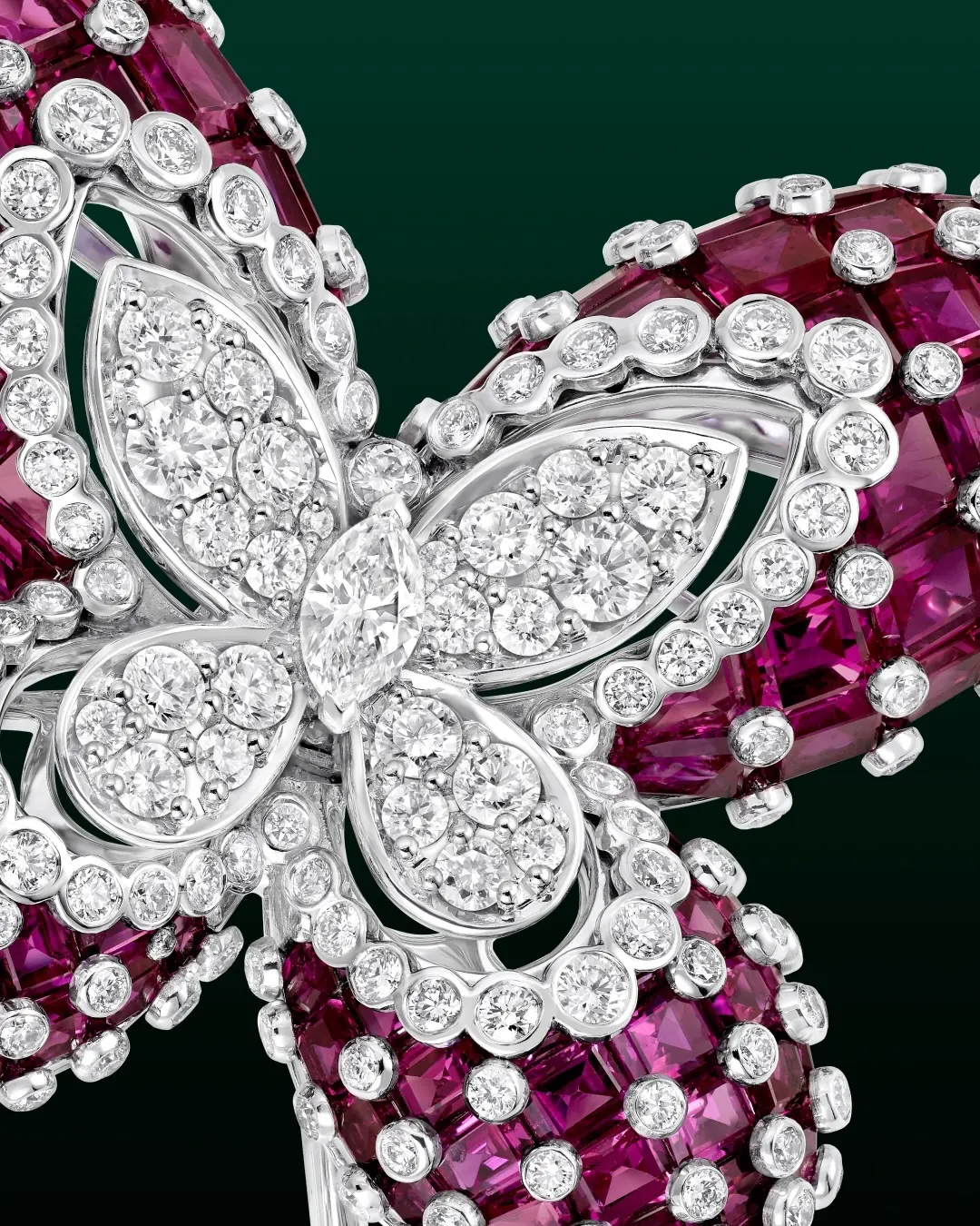 Close-up of Graff Lina brooch GP110859 showing pink sapphire paving with white diamond wing tips and contour lines