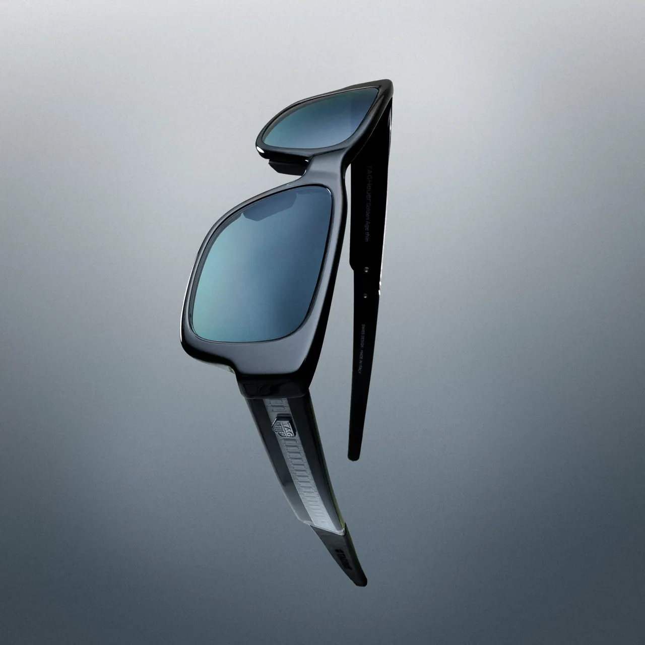 TAG Heuer Jack Heuer pilot-shape sunglasses in shiny palladium titanium with red bio-nylon temple tips