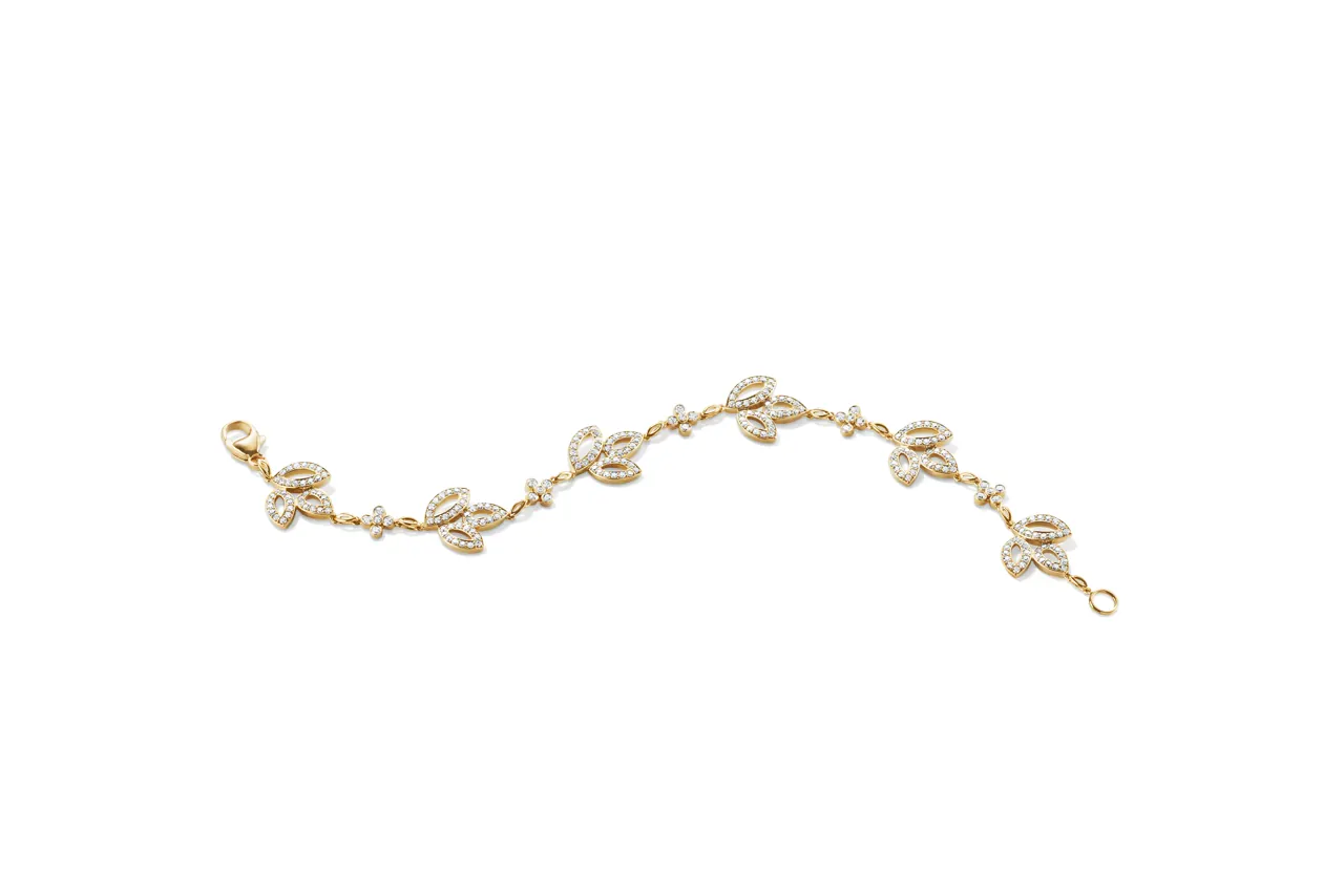 Harry Winston Lily Cluster Collection detail showing sculptural petal form in yellow gold