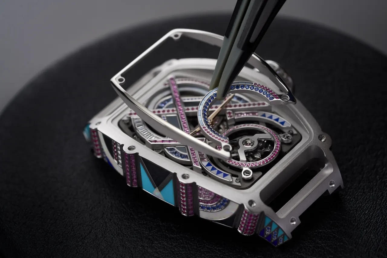 Richard Mille RM HJ-02 green universe close-up of asymmetrical case planes and bezel-set stones