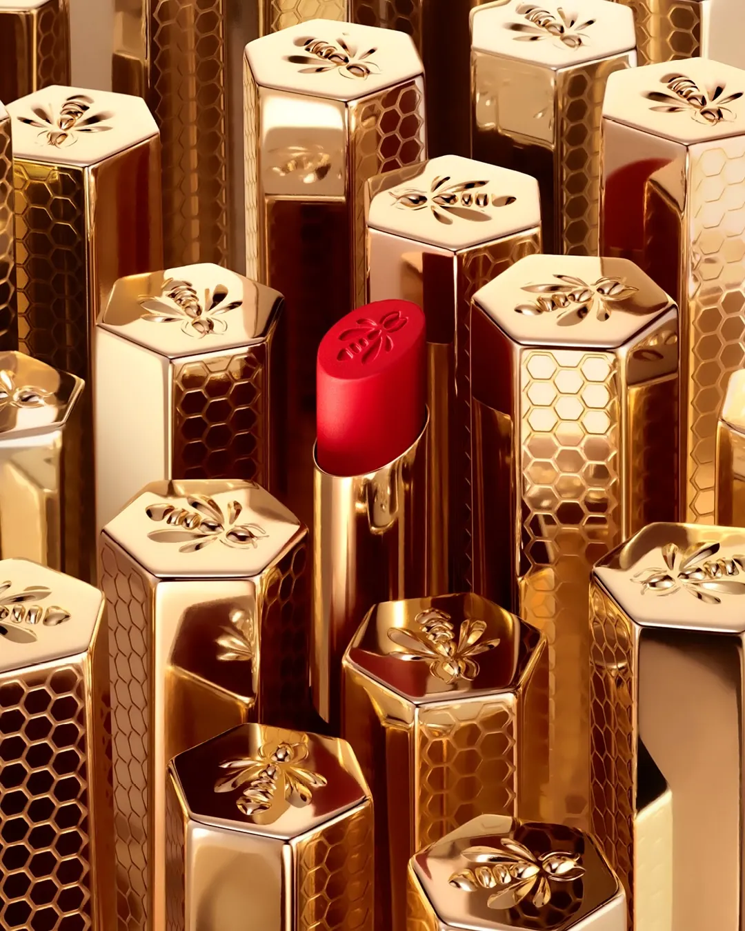 Guerlain KissKiss Honey-Infused Intense Lipstick in golden refillable case with bee motif