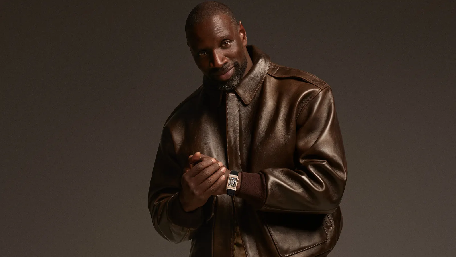 Omar Sy wearing a Jaeger-LeCoultre timepiece as the new Friend of the House