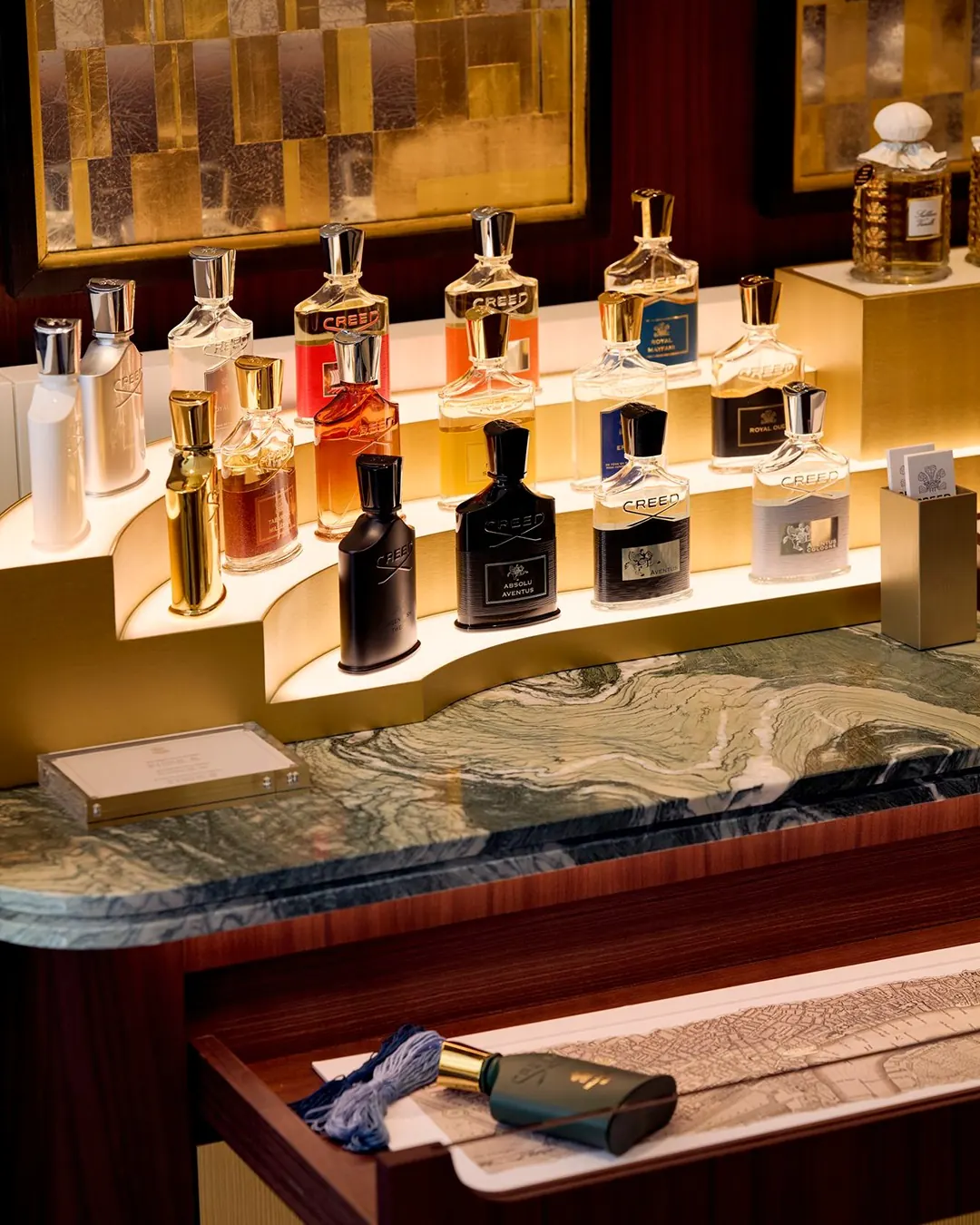 Creed Boutique Saint-Honoré interior with American walnut panelling and Verde Luana marble accents