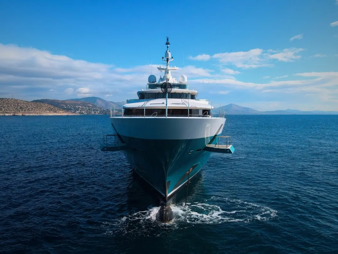 Oceanco Sunrays 85.5-metre motor yacht exterior view with teal hull and Björn Johansson dagger bow design