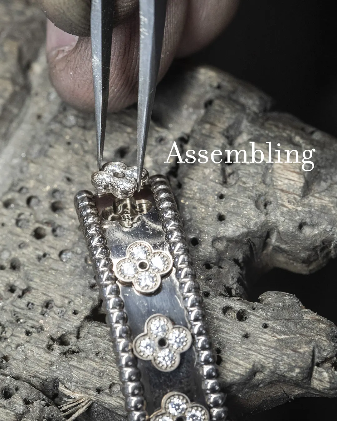 Close-up of the golden bead clover motif on the Van Cleef and Arpels Perlee Clovers Bracelet showing diamond setting