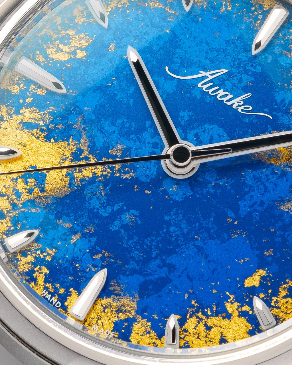 Close-up of AWAKE Royal Blue Sơn Mài lacquer dial with gold leaf gilding detail