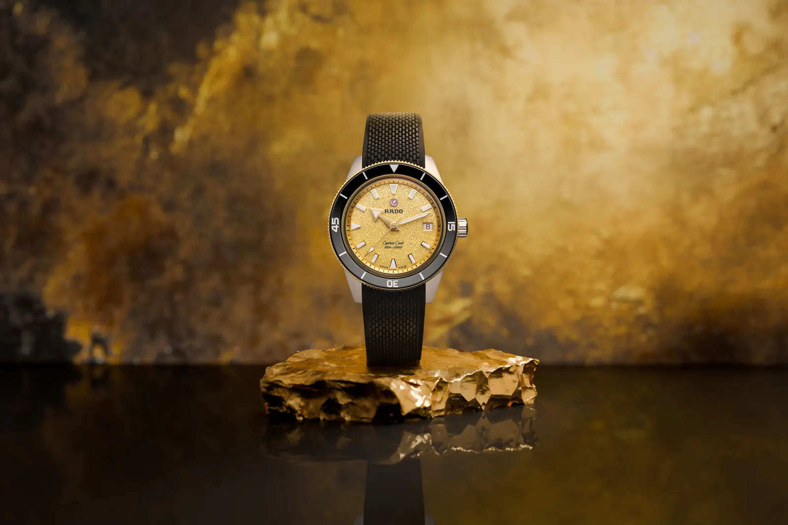Close-up of the Rado Captain Cook Shimmering Intensity dial showing sparkling golden texture and applied indices