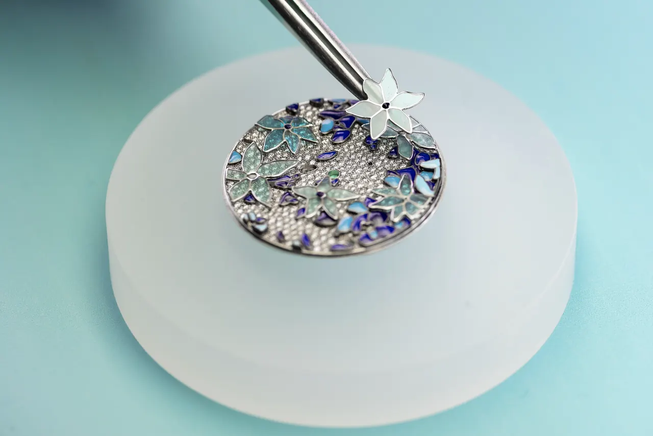 Close-up of champlevé enamel floral motifs on the Tiffany Eternity Clematis dial