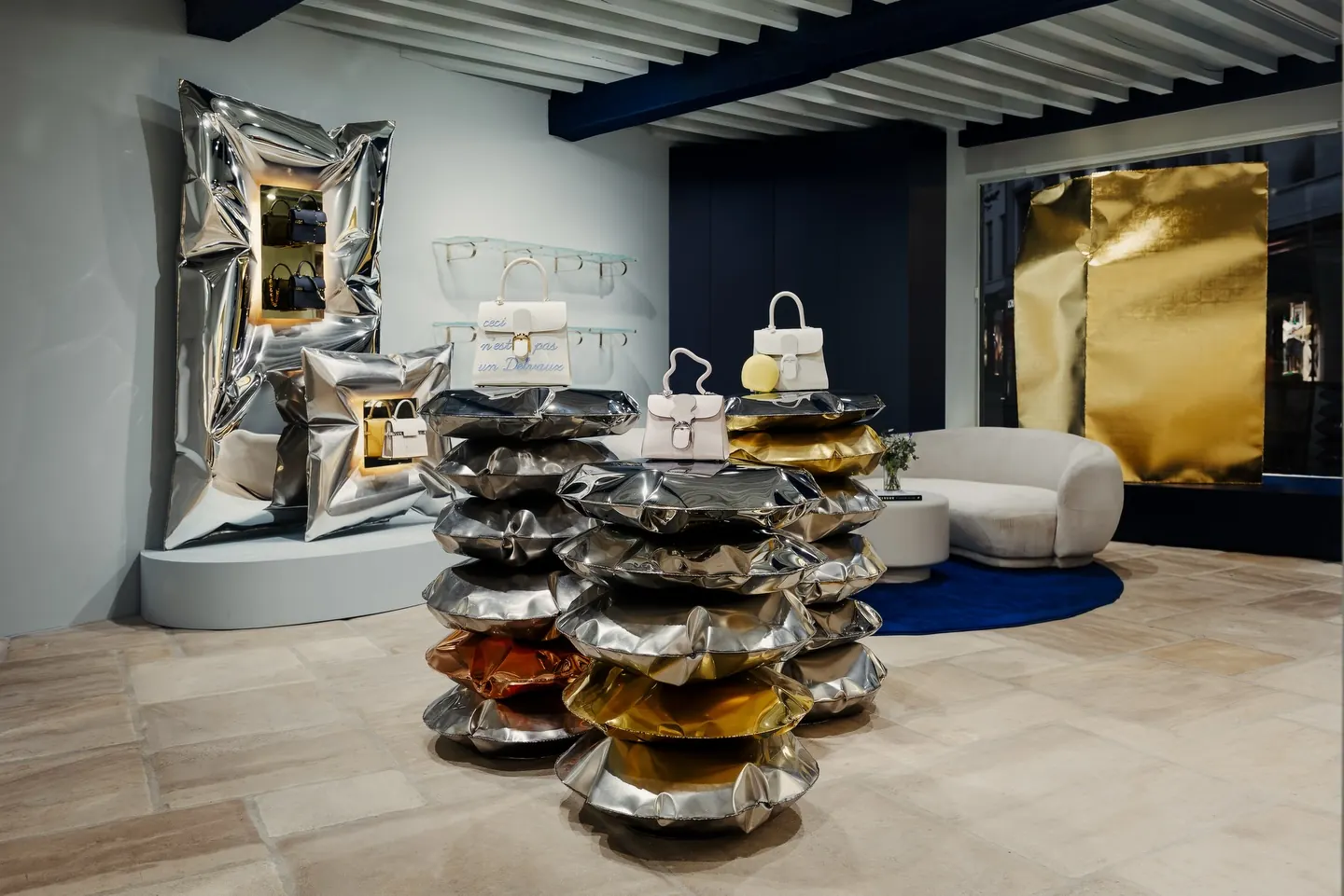 Hydroformed stainless steel cushion from Ben Storms In Hale series alongside Delvaux leather goods