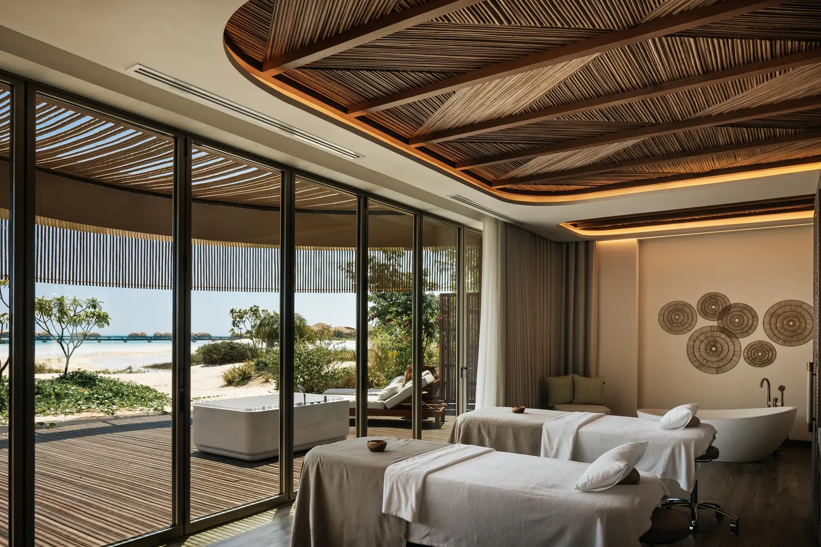 Copper pool and glass pendant at the reception of Neyrah Spa Nujuma Red Sea
