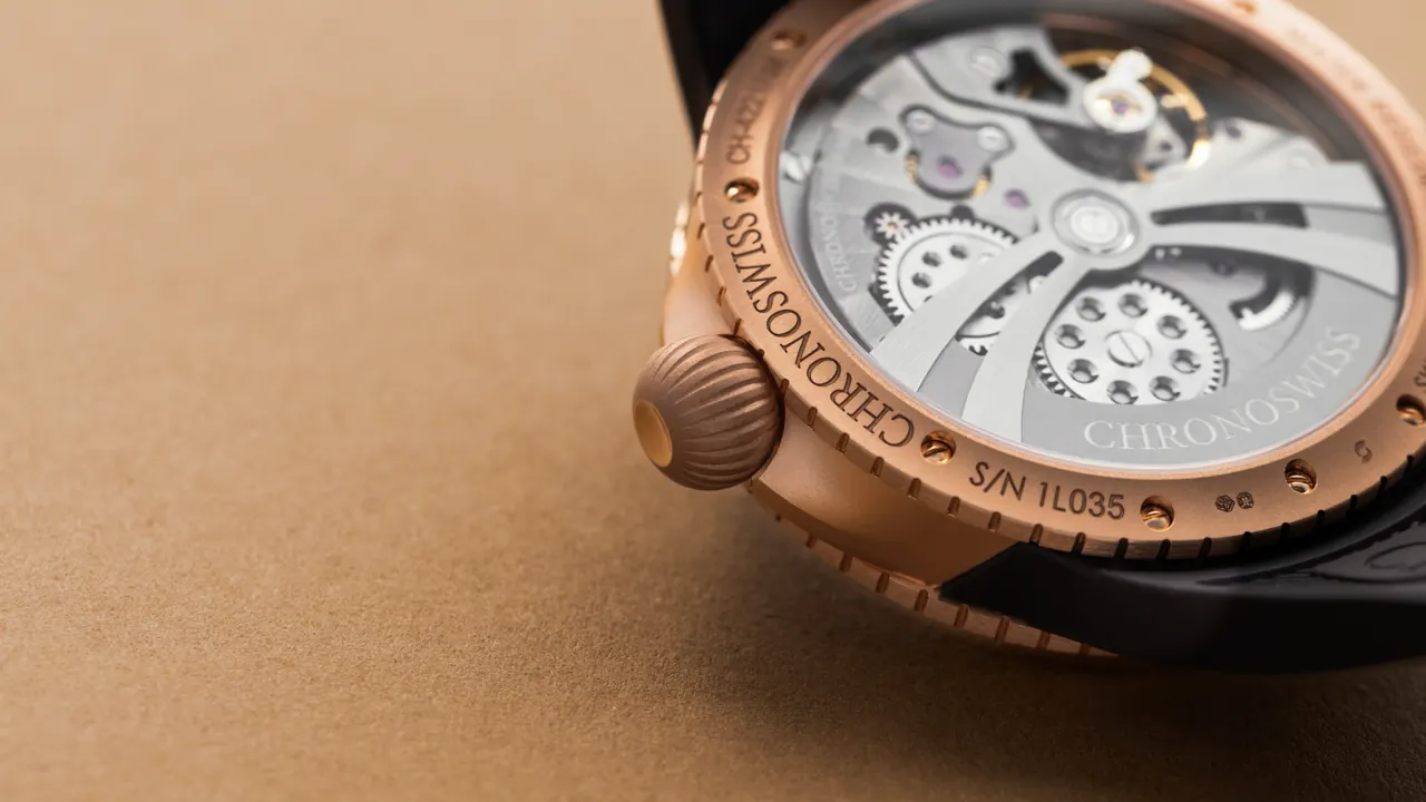 Chronoswiss Pulse GMT Frosted Guilloche Gold GMT discs at 3 and 9 o'clock positions