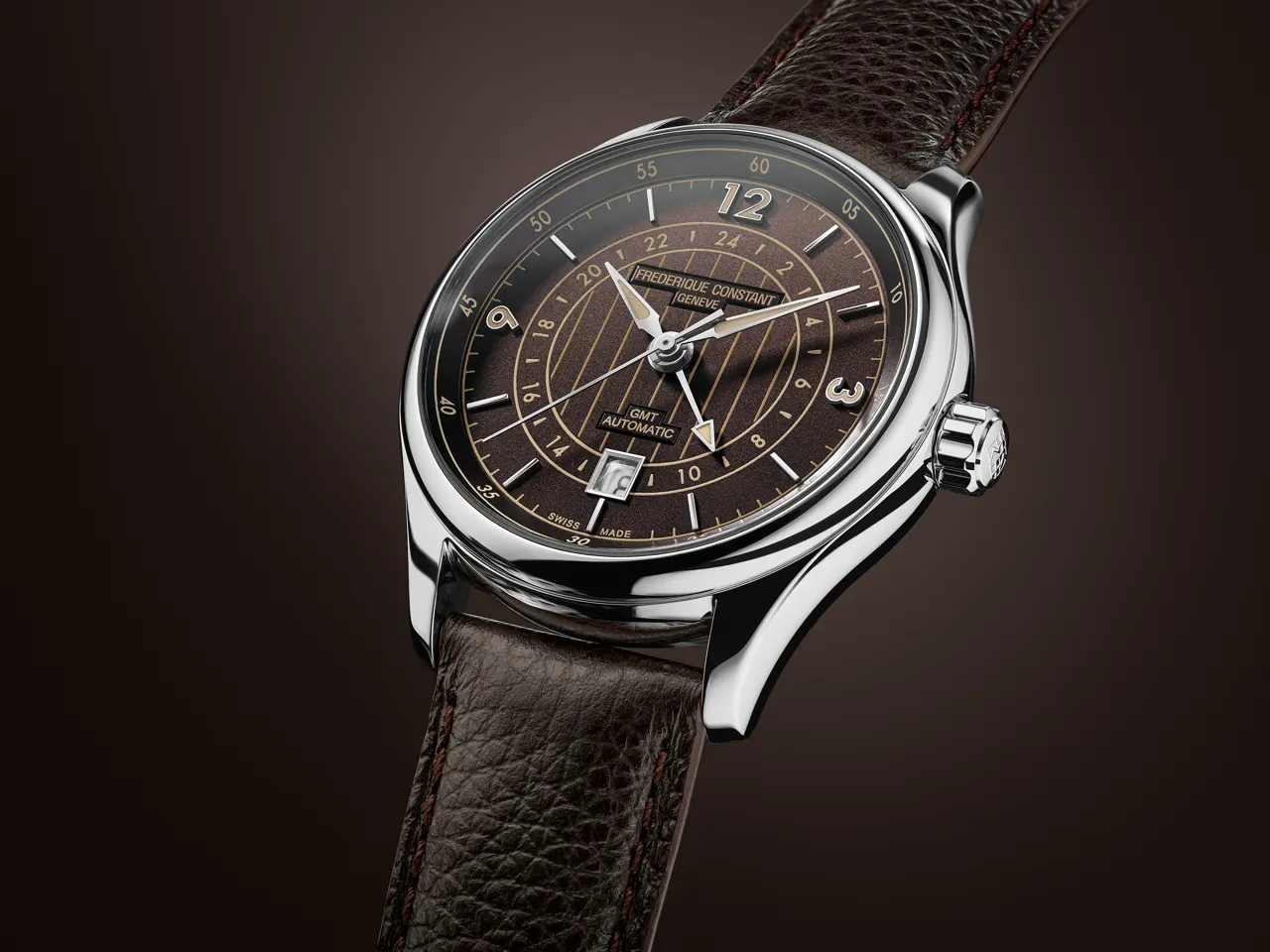 Smoked sapphire caseback of the Frederique Constant Classics Runabout Automatic GMT revealing Côtes de Genève finishing and Riva Historical Society logo
