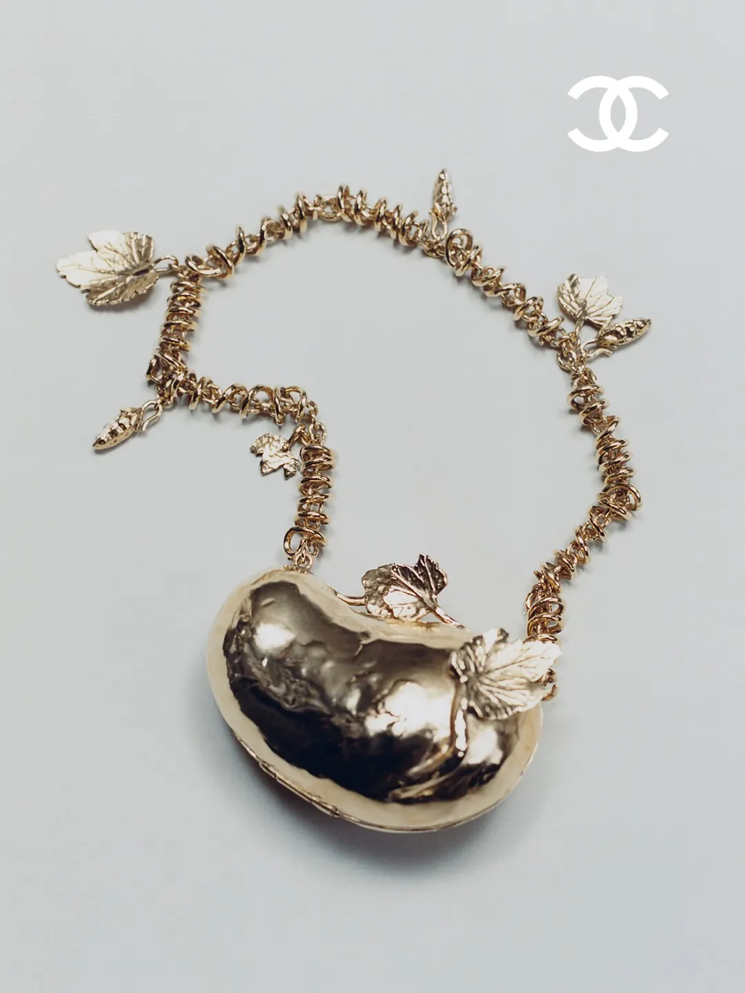 Chanel FW26 couture accessories including pea pod heels and bean-shaped minaudières