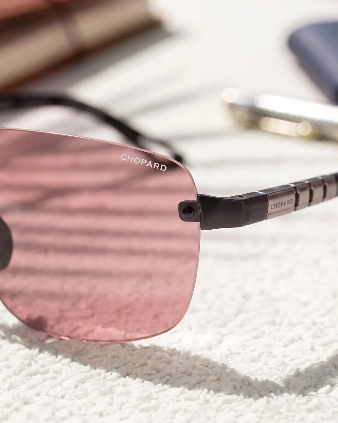 Chopard Racing sunglasses SCHM39 in Cognac Brown with titanium temple inserts