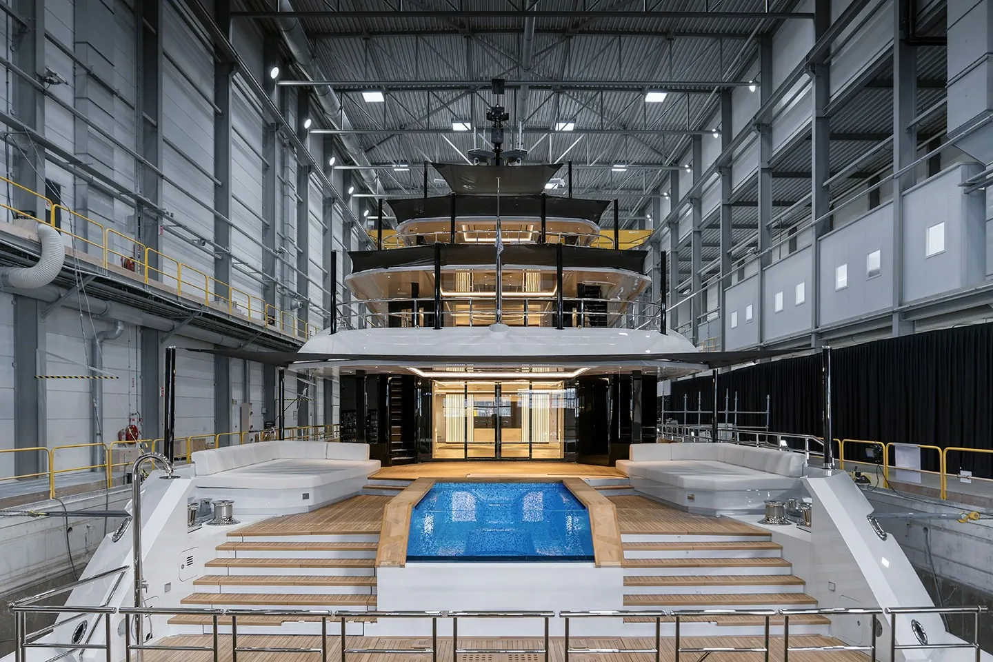 Heesen Project Setteesettanta 57-metre full-custom superyacht stern view with infinity pool and double staircase, launched July 2026