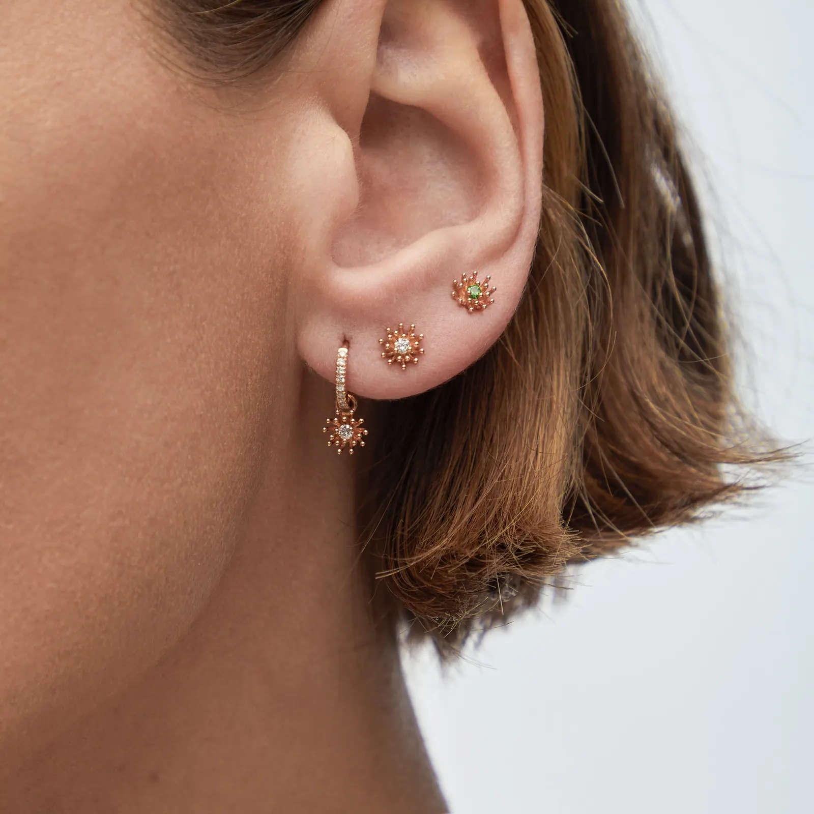 Three expressions of the Mellerio Petit Cactus Vanille collection in yellow, green and pink gold tones