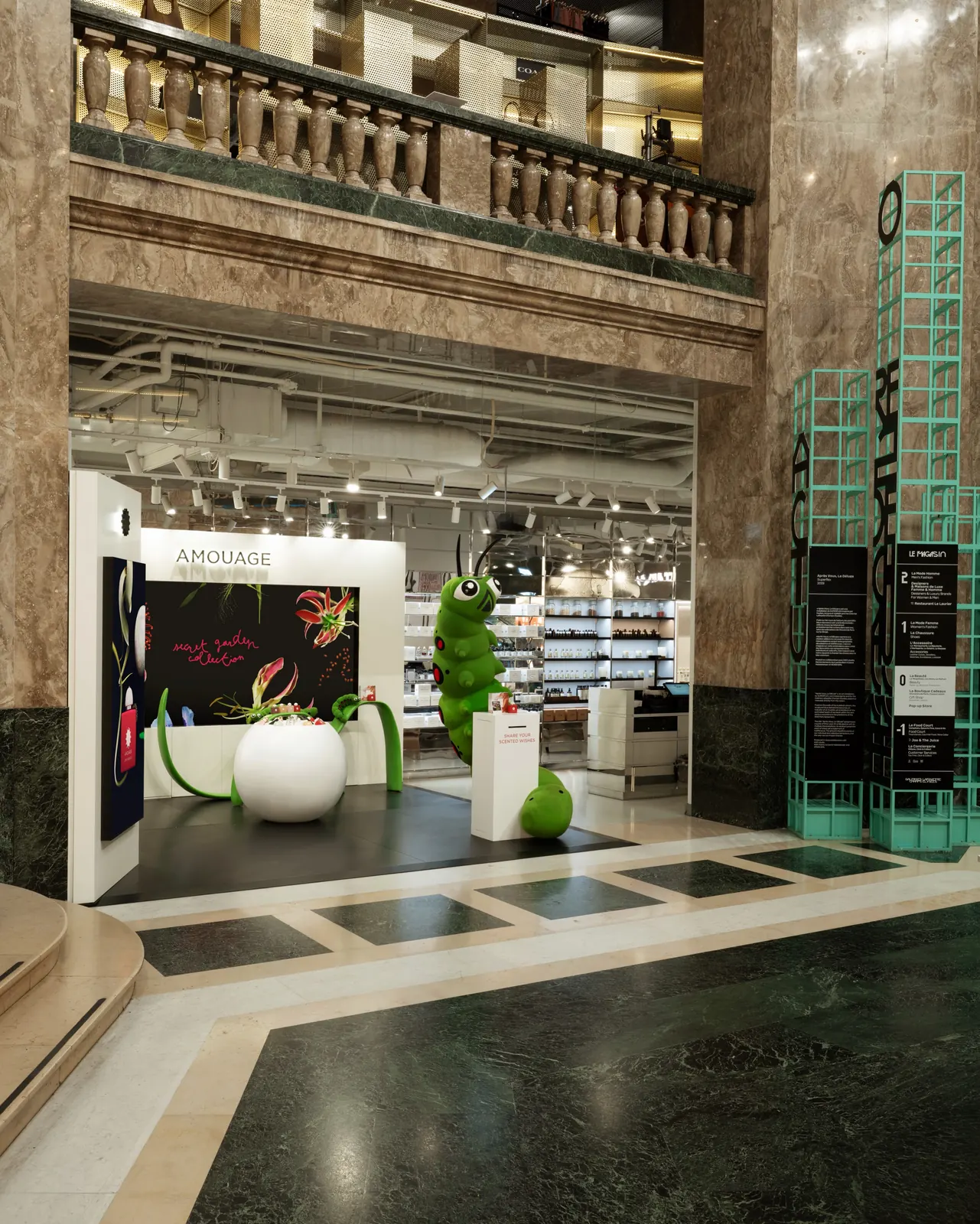 Love Hibiscus fragrance bottle displayed in red immersive environment at Galeries Lafayette 2026