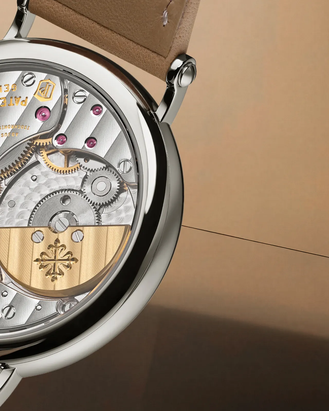 Caliber 240 ultra-thin movement with 22K gold mini-rotor visible through sapphire caseback