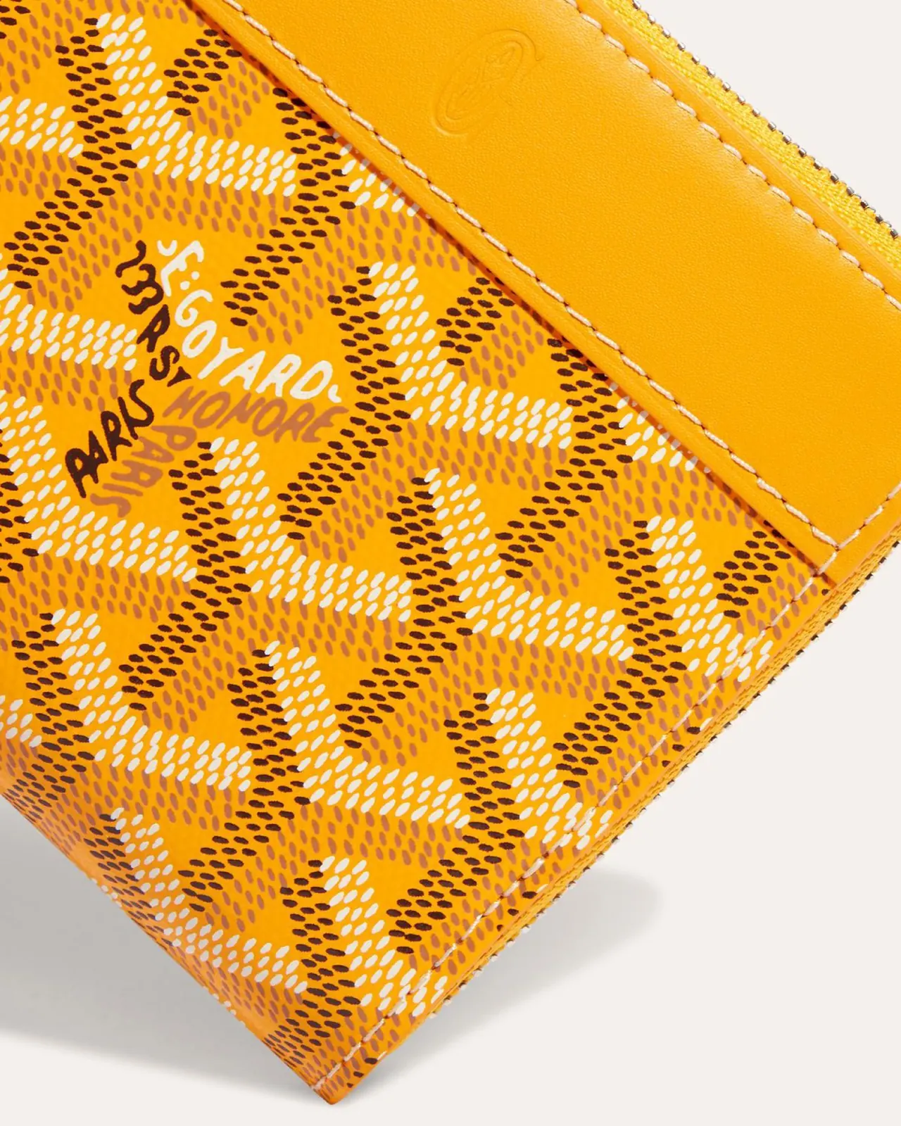 Hand-painted personalisation on a Goyard small leather good