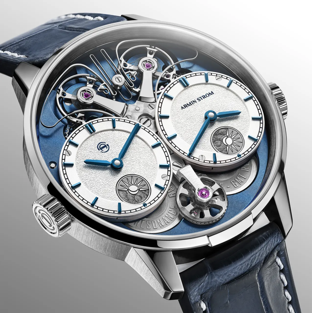 Armin Strom Dual Time GMT Resonance Blue caseback revealing blue gear-train bridges and laser-engraved relief lettering