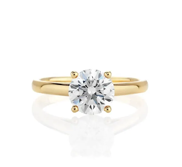 De Beers yellow gold solitaire ring close-up detail